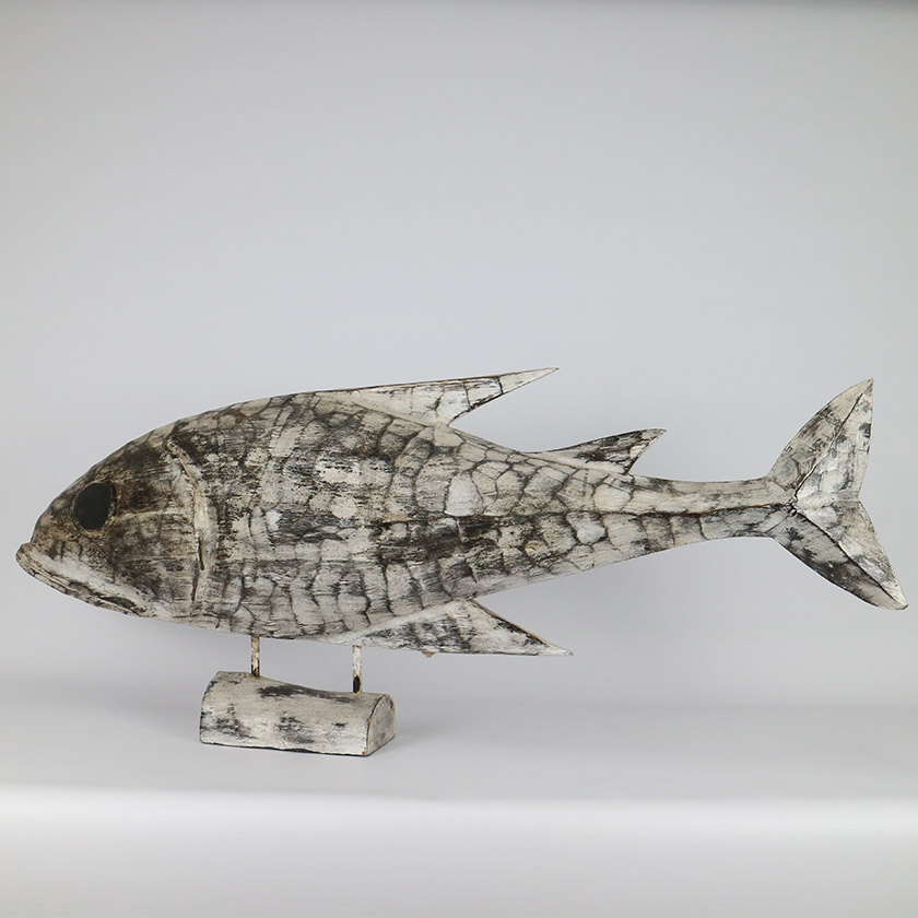 Carved wooden fish sculpture on a stand, made from mango wood.