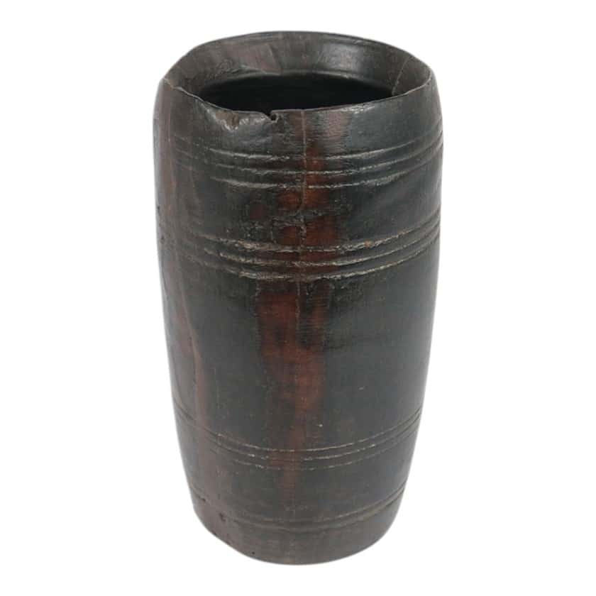 Handcrafted wooden milk jug with dark finish and carved details.